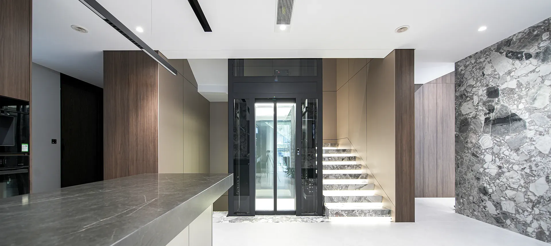 Youjia G1 home elevator with a glass-panelled cabin