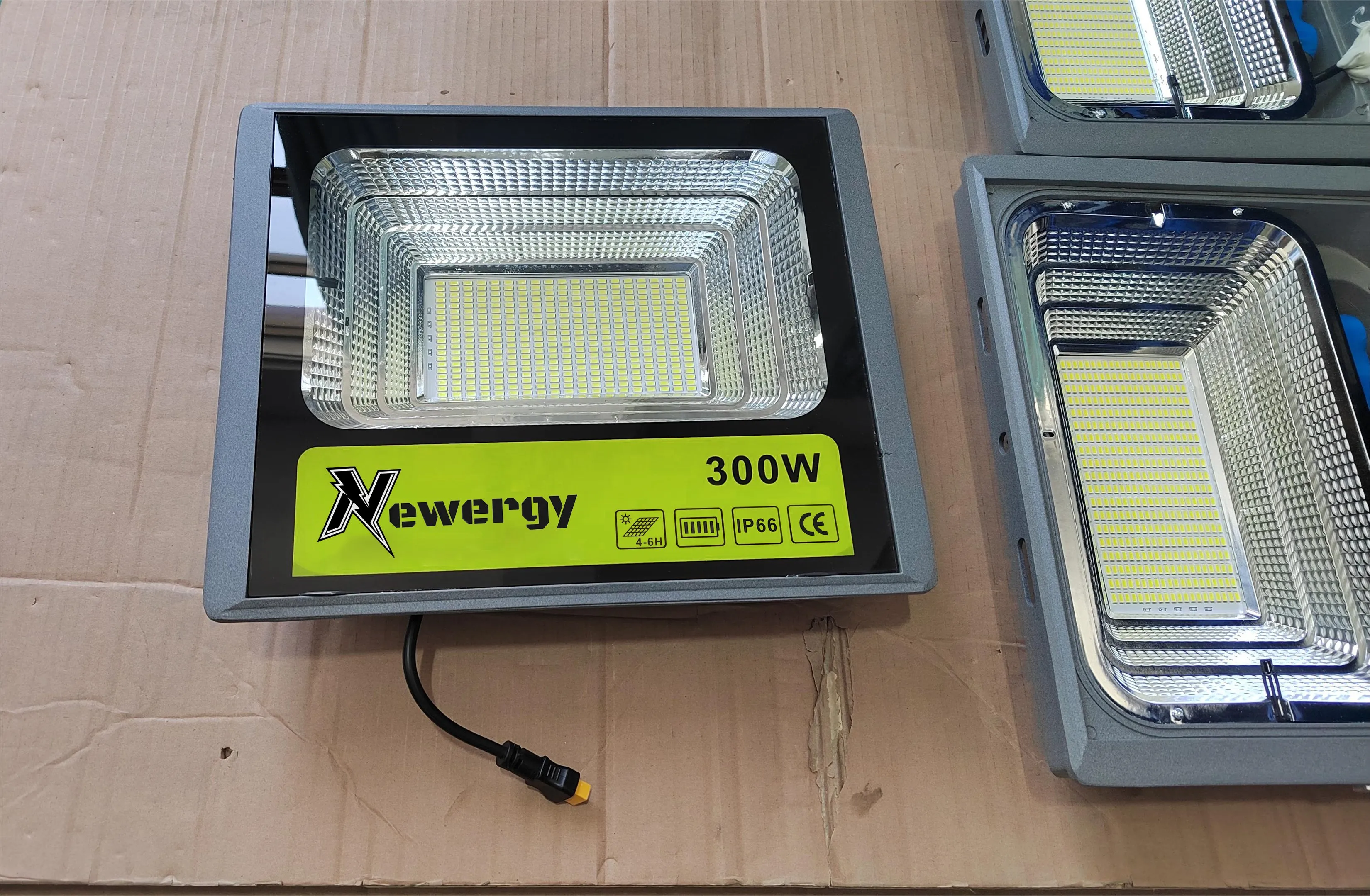 Newergy solar flood lights laid out before installation
