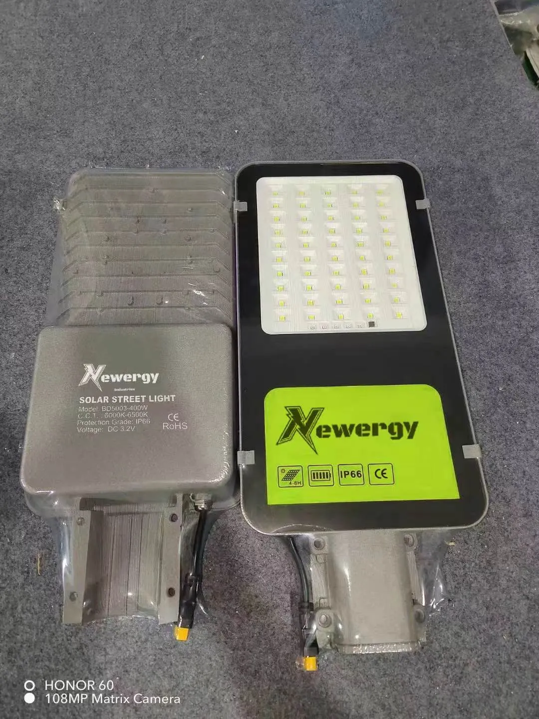 A Newergy solar street light unit with its LED panel exposed