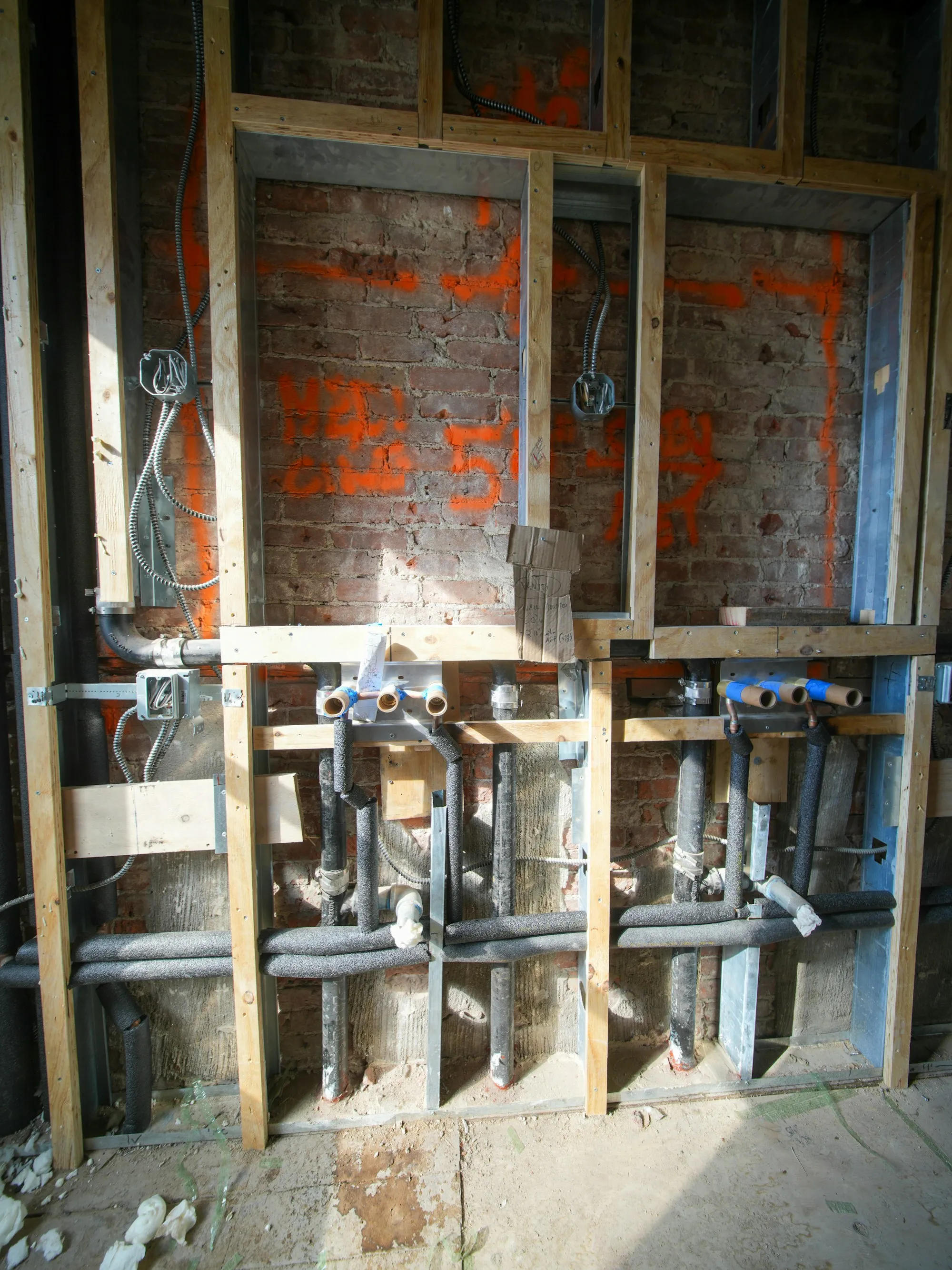 Cabling and services roughed into open walls
