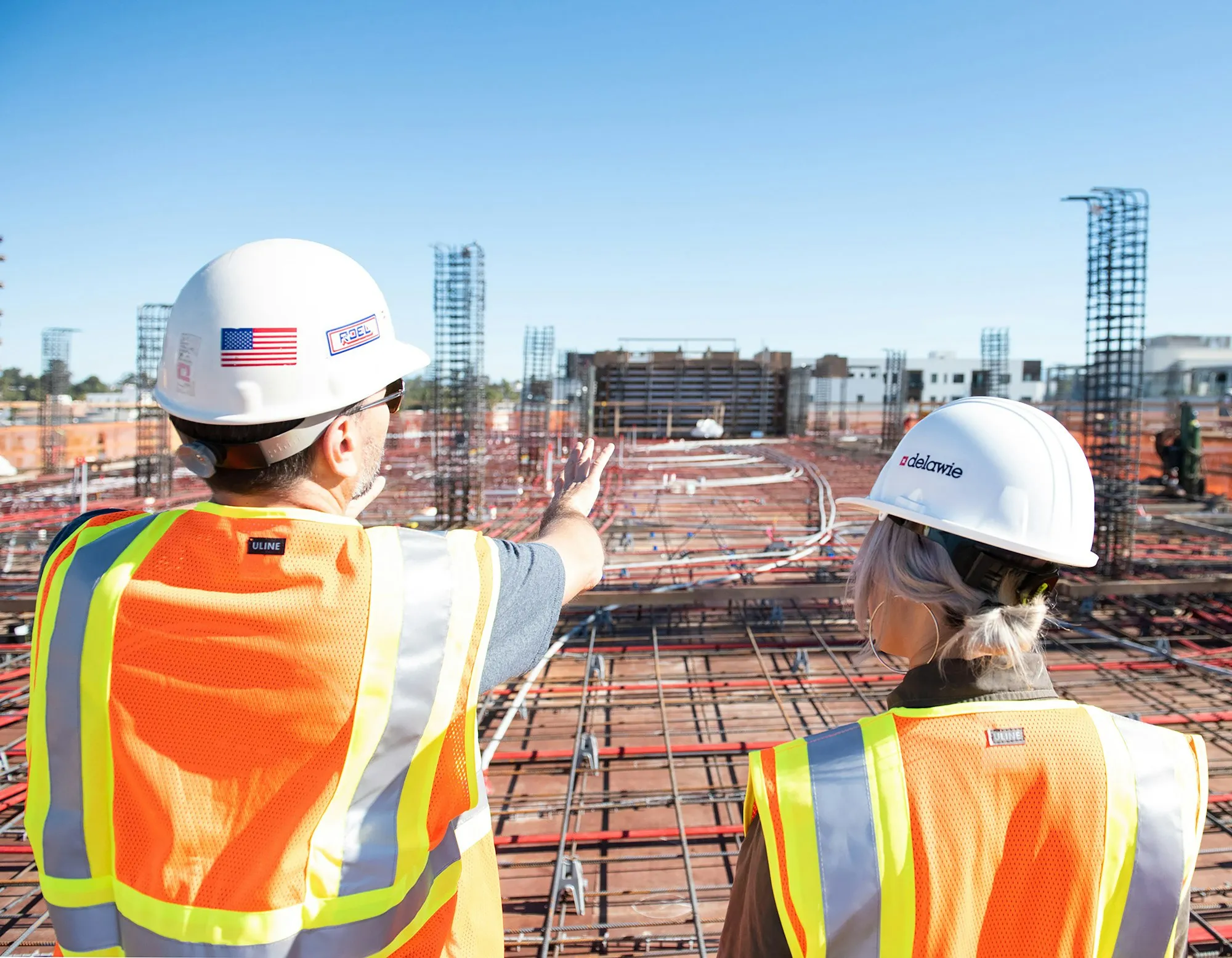 Two supervisors reviewing a reinforced deck before the pour